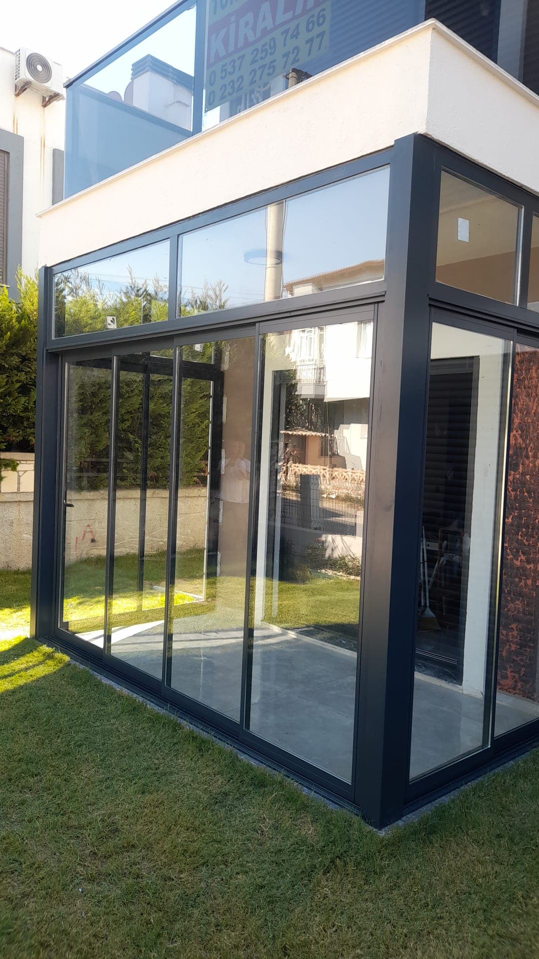 Güzelbahçe villa antrasit sürme cam balkon kış bahçesi | Günsan Alüminyum İzmir Güzelbahçe villa antrasit sürme cam balkon kış bahçesi — İzmir Cam Balkon montajı, Günsan Alüminyum